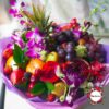 Букет из экзотических фруктов, ягод и цветов